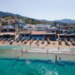 A breathtaking view of the beautiful coast and bay of Agia Pelagia near Heraklion, Crete, Greece. Crystal-clear waters, sandy beaches, and a picturesque landscape create a perfect Mediterranean escape