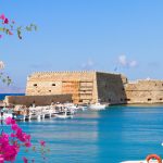 Heraklion harbour with old venetian fort, Crete, Greece with flowers