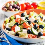 Greek salad with fresh vegetables, feta cheese and black olives