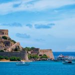 Island of Spinalonga with old fortress former leper colony and the bay of Elounda, Crete island, Greece