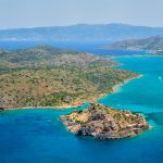 Island of Spinalonga with old fortress former leper colony and the bay of Elounda, Crete island, Greece