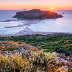 Island Gramvousa and the beautiful Balos beach on sunset in Crete island, Greece. Horizontal camera pan